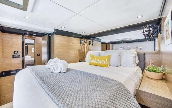 Euphoria Yacht Photos Pics Luxurious bedroom interior of 2016 Sunreef 60 LOFT yacht with modern decor and cozy bedding.
