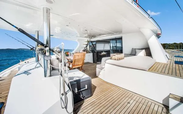 Euphoria Yacht Photos Pics Luxurious Sunreef 60 LOFT yacht deck with seating, 2016 model, on a sunny day at sea.