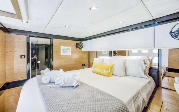 Euphoria Yacht Photos Pics Luxurious Sunreef 60 LOFT 2016 yacht bedroom with modern decor and plush bedding.