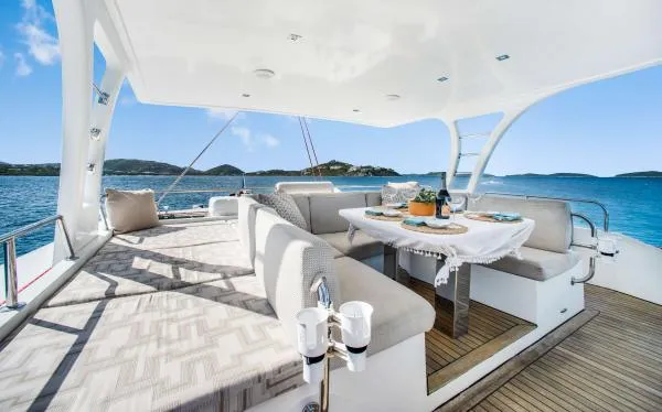 Euphoria Yacht Photos Pics Luxurious Sunreef 60 LOFT yacht deck with elegant dining area, 2016 model, scenic ocean view.