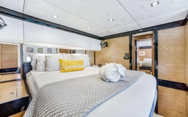 Euphoria Yacht Photos Pics Luxurious bedroom interior of 2016 Sunreef 60 LOFT yacht with elegant bedding and decor.