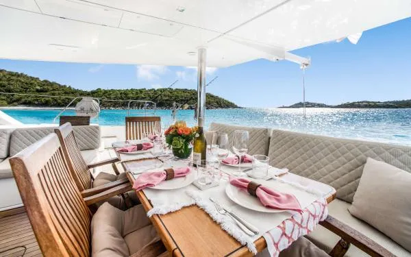 Euphoria Yacht Photos Pics Luxurious dining setup on 2016 Sunreef 60 LOFT yacht with ocean view.
