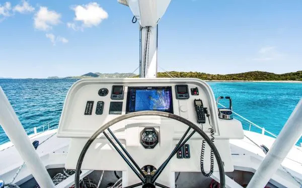 Euphoria Yacht Photos Pics Helm of 2016 Sunreef 60 LOFT yacht with ocean view and navigation equipment.