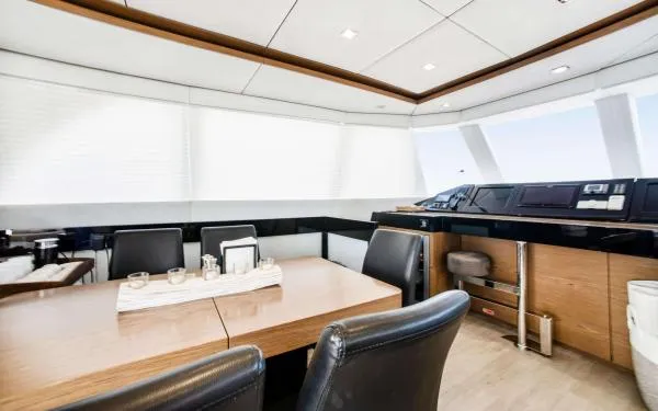 Euphoria Yacht Photos Pics Luxurious interior of 2016 Sunreef 60 LOFT yacht with modern dining and navigation area.