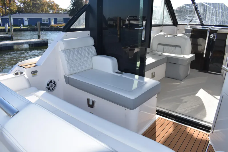  Yacht Photos Pics 2024 Regal 36 XO boat interior with luxurious seating and modern design.