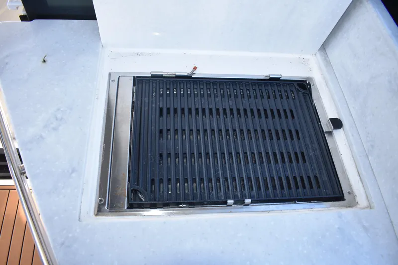  Yacht Photos Pics Built-in grill on 2024 Regal 36 XO yacht, featuring sleek design and functionality.