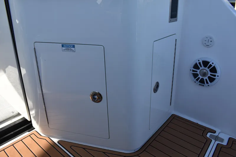  Yacht Photos Pics 2024 Regal 36 XO boat interior with storage compartment and speaker.