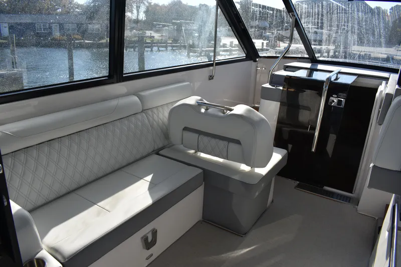  Yacht Photos Pics 2024 Regal 36 XO boat interior with elegant seating and modern design.