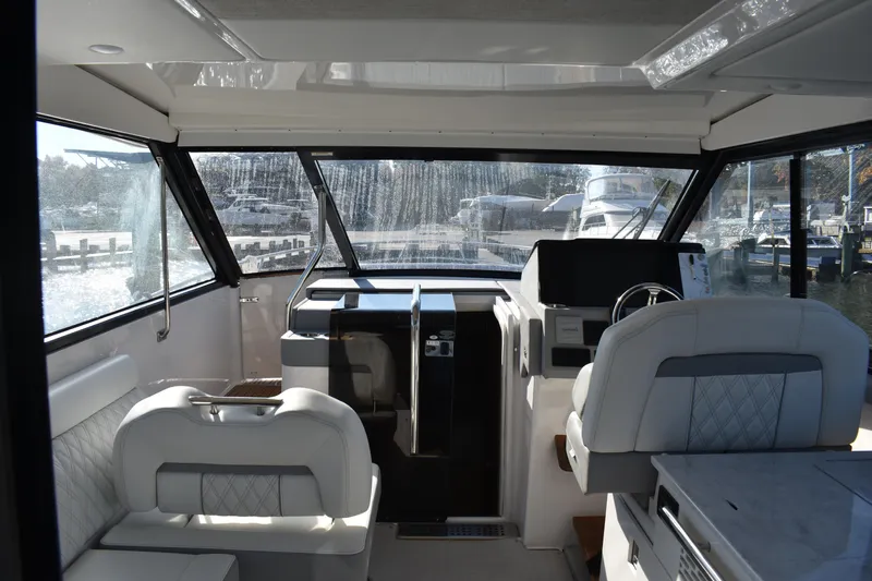  Yacht Photos Pics Interior of 2024 Regal 36 XO yacht, featuring modern helm and seating area.