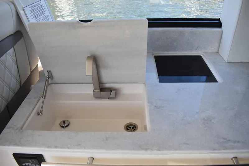  Yacht Photos Pics 2024 Regal 36 XO yacht kitchen with modern sink and sleek countertop design.
