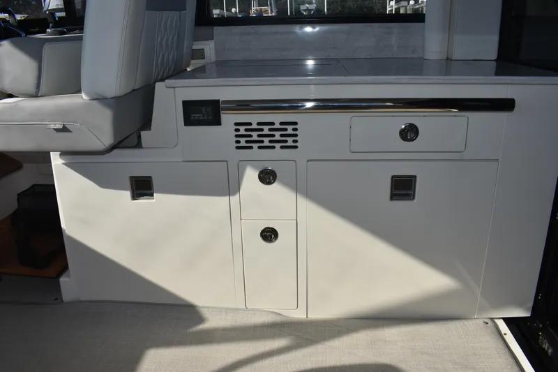 Yacht Photos Pics 2024 Regal 36 XO interior with sleek cabinetry and modern seating design.