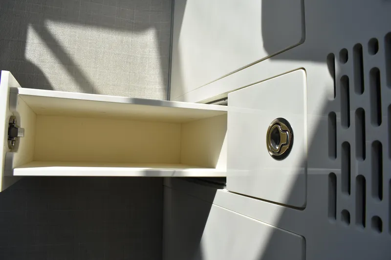 Yacht Photos Pics 2024 Regal 36 XO boat interior storage compartment with sleek design and modern finish.