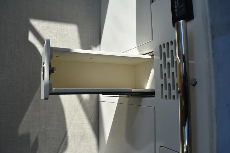  Yacht Photos Pics Open drawer in 2024 Regal 36 XO boat interior, showcasing sleek design and functionality.