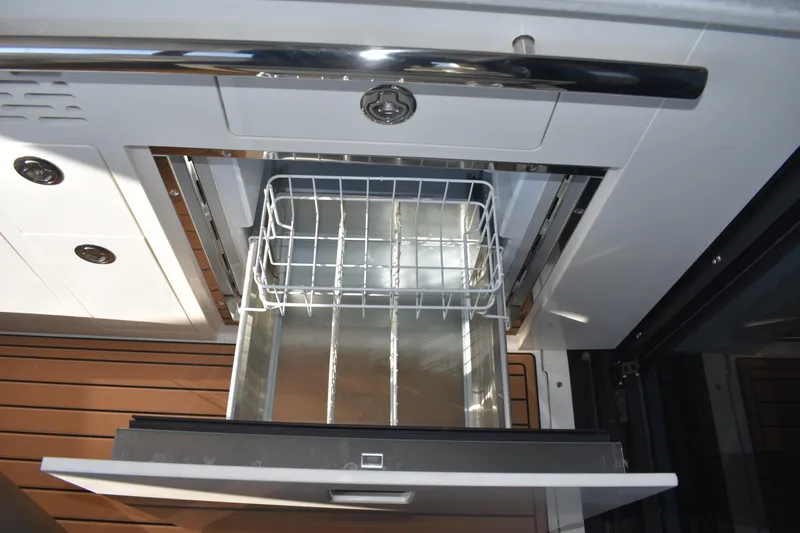  Yacht Photos Pics 2024 Regal 36 XO yacht interior drawer with metal basket, showcasing sleek design.