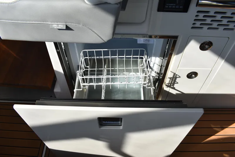  Yacht Photos Pics 2024 Regal 36 XO yacht interior with open drawer and wire basket.