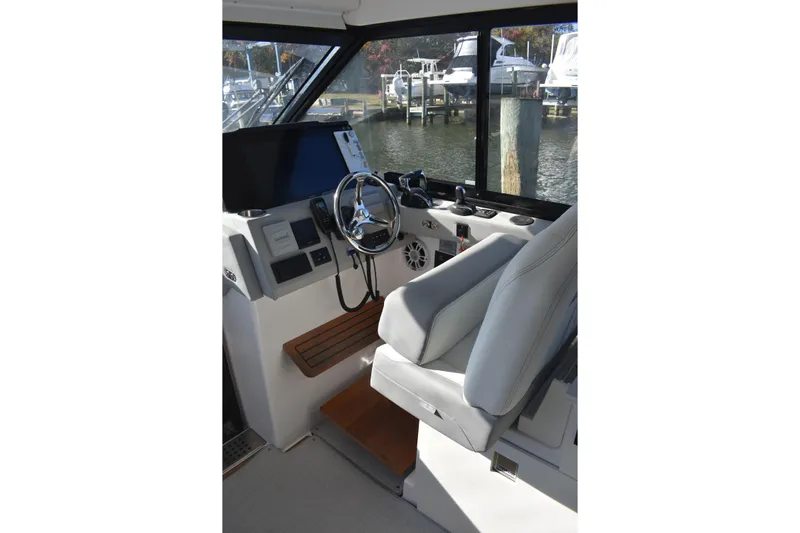  Yacht Photos Pics 2024 Regal 36 XO boat helm with modern controls and comfortable seating.