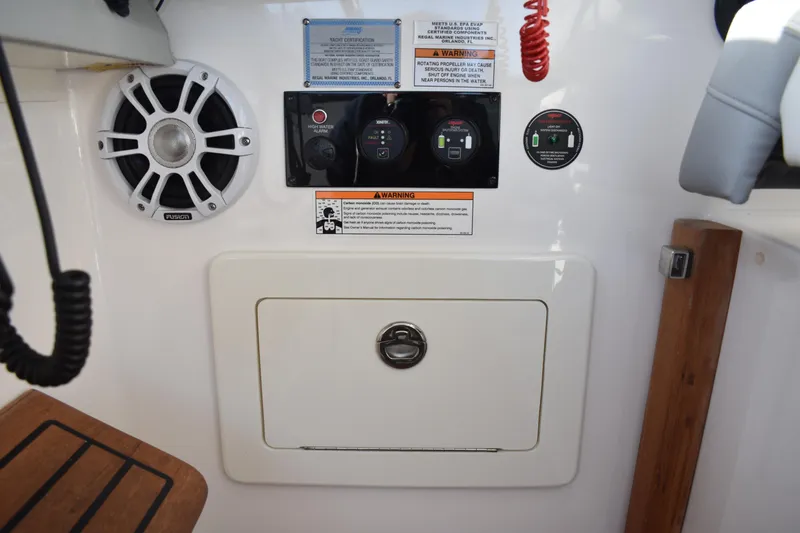  Yacht Photos Pics 2024 Regal 36 XO boat control panel with speaker and warning labels.
