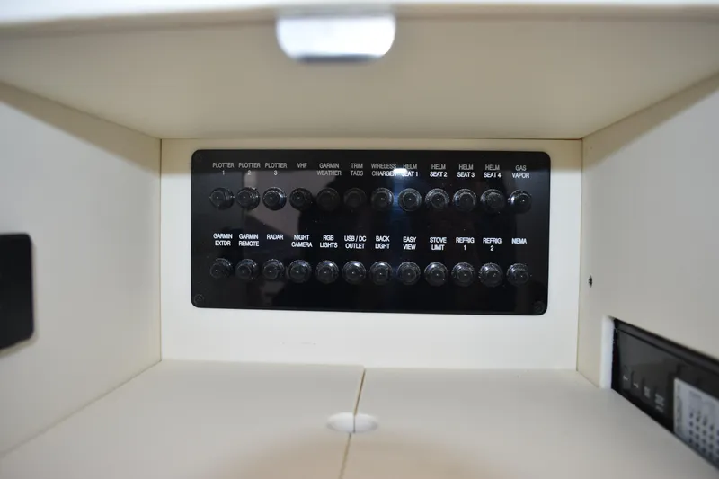  Yacht Photos Pics Control panel of 2024 Regal 36 XO boat with labeled switches and buttons.