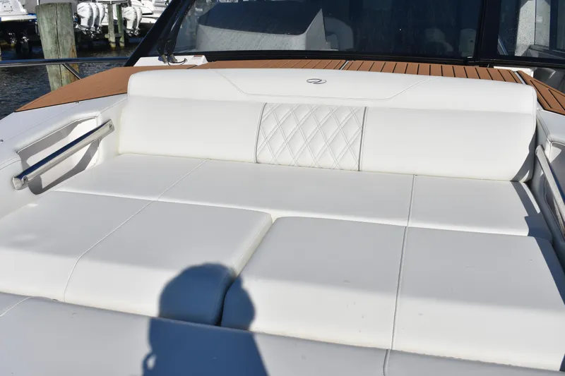  Yacht Photos Pics Luxurious seating on 2024 Regal 36 XO boat with white upholstery and elegant design.