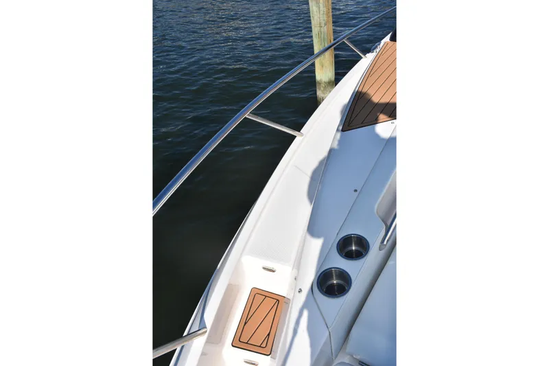  Yacht Photos Pics 2024 Regal 36 XO boat deck with cup holders and wood accents.