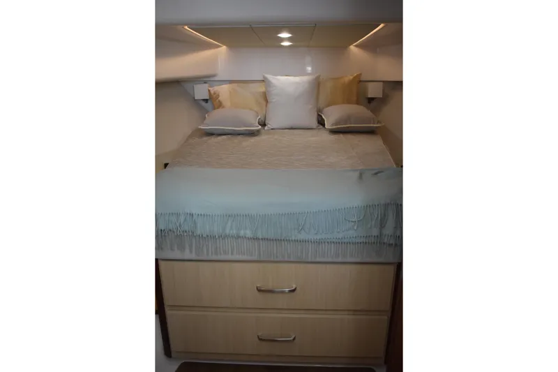  Yacht Photos Pics Luxurious cabin interior of 2024 Regal 36 XO yacht with elegant bedding.