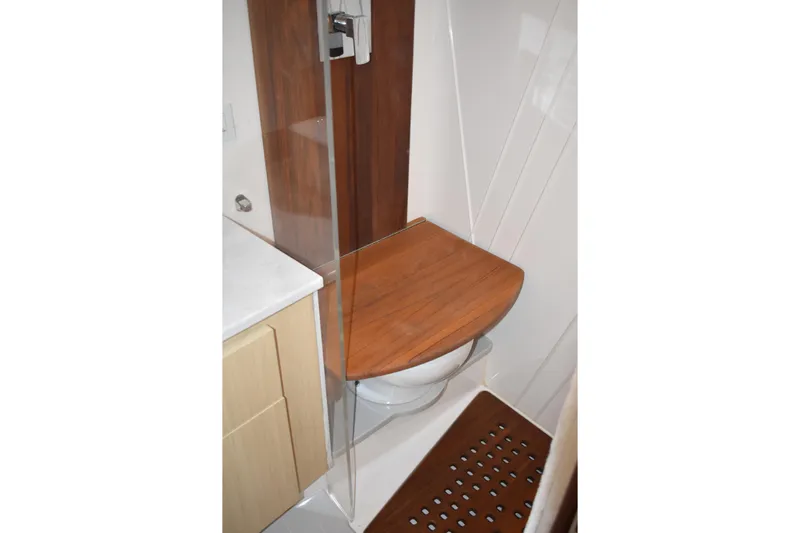  Yacht Photos Pics 2024 Regal 36 XO yacht bathroom with wooden seat and modern design.