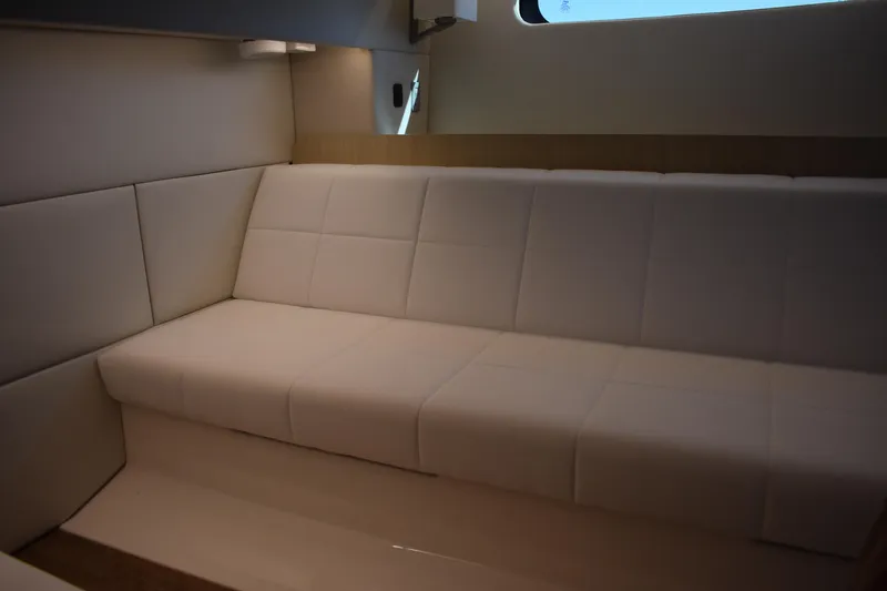  Yacht Photos Pics Luxurious interior seating of 2024 Regal 36 XO yacht, featuring elegant white upholstery.