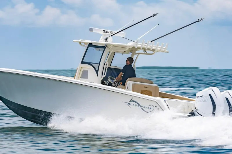  Yacht Photos Pics 2027 Blackwater 36 Sportfish cruising on open water under a clear sky.