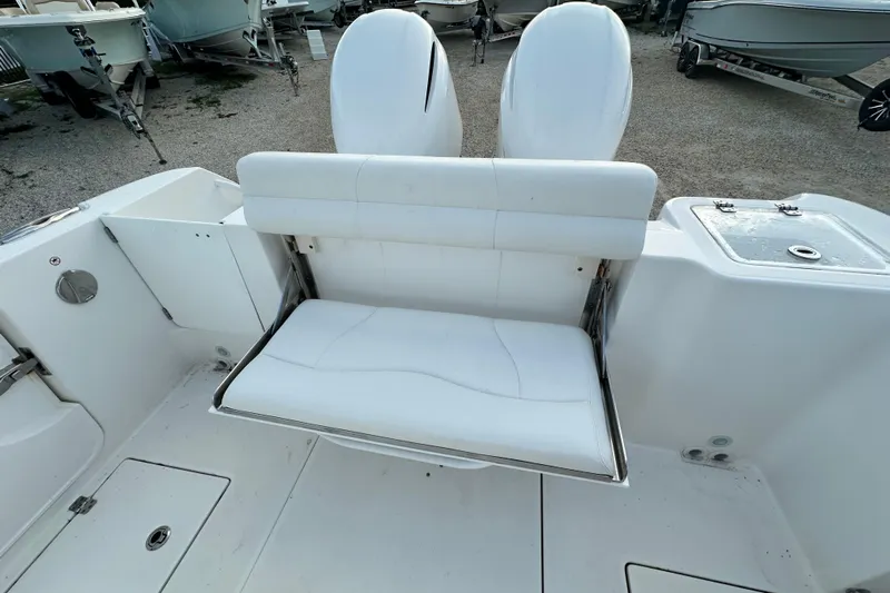  Yacht Photos Pics 2021 Edgewater 262CC boat interior with white seating and dual engines.