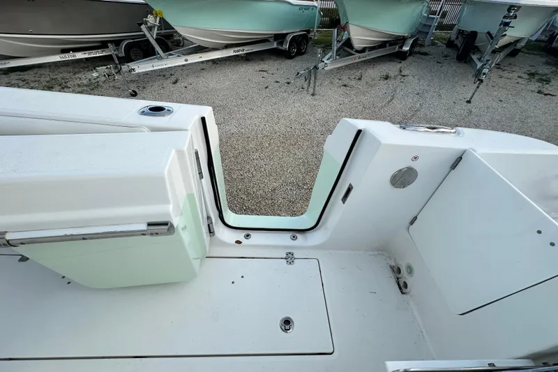  Yacht Photos Pics 2021 Edgewater 262CC boat interior with open transom door, showing clean deck design.