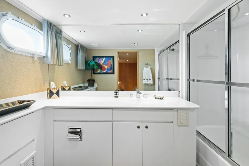 Crown Jewel Yacht Photos Pics Luxurious bathroom on 1996 Broward 96 Raised Pilothouse MY yacht, featuring modern fixtures and decor.