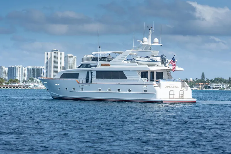 Crown Jewel Yacht Photos Pics Luxury yacht Broward 96 Raised Pilothouse MY, 1996, cruising near city skyline.