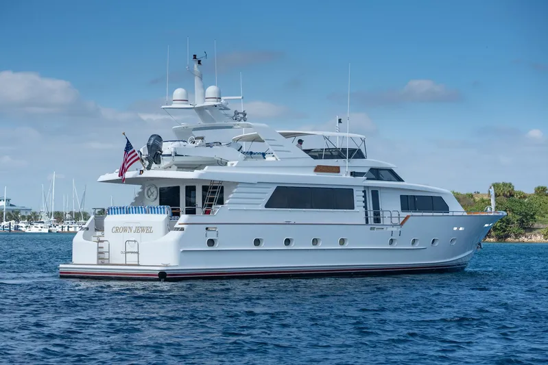 Crown Jewel Yacht Photos Pics Luxury 1996 Broward 96 Raised Pilothouse yacht on calm blue waters.