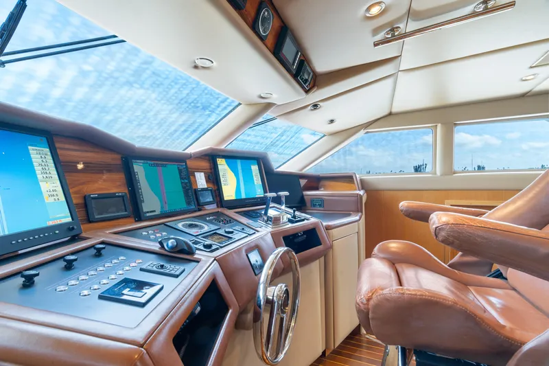 Crown Jewel Yacht Photos Pics Luxurious 1996 Broward 96 Raised Pilothouse MY yacht cockpit with advanced navigation systems.