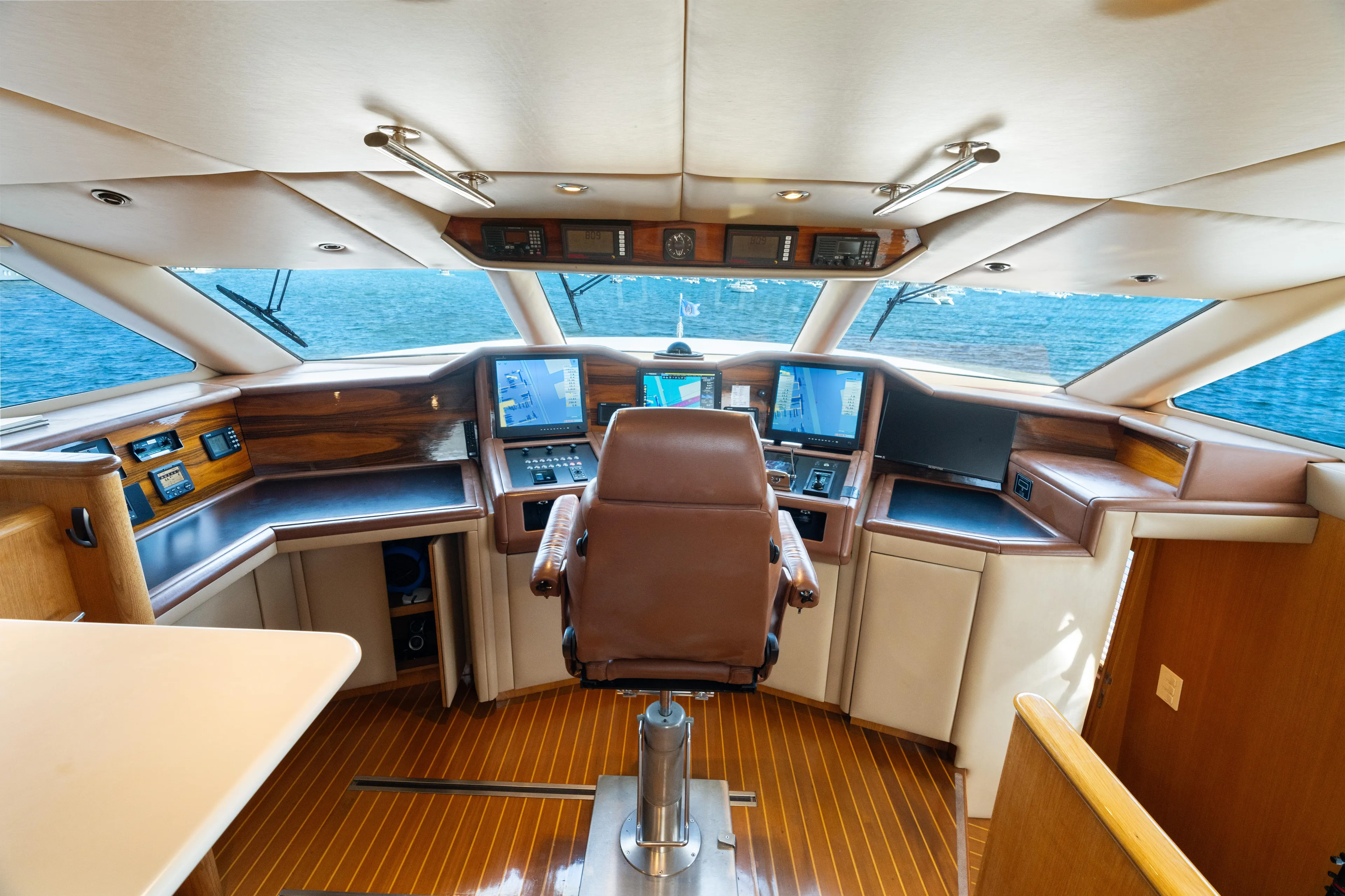 Crown Jewel Yacht Photos Pics Luxurious 1996 Broward 96 Raised Pilothouse MY yacht interior with advanced navigation systems.