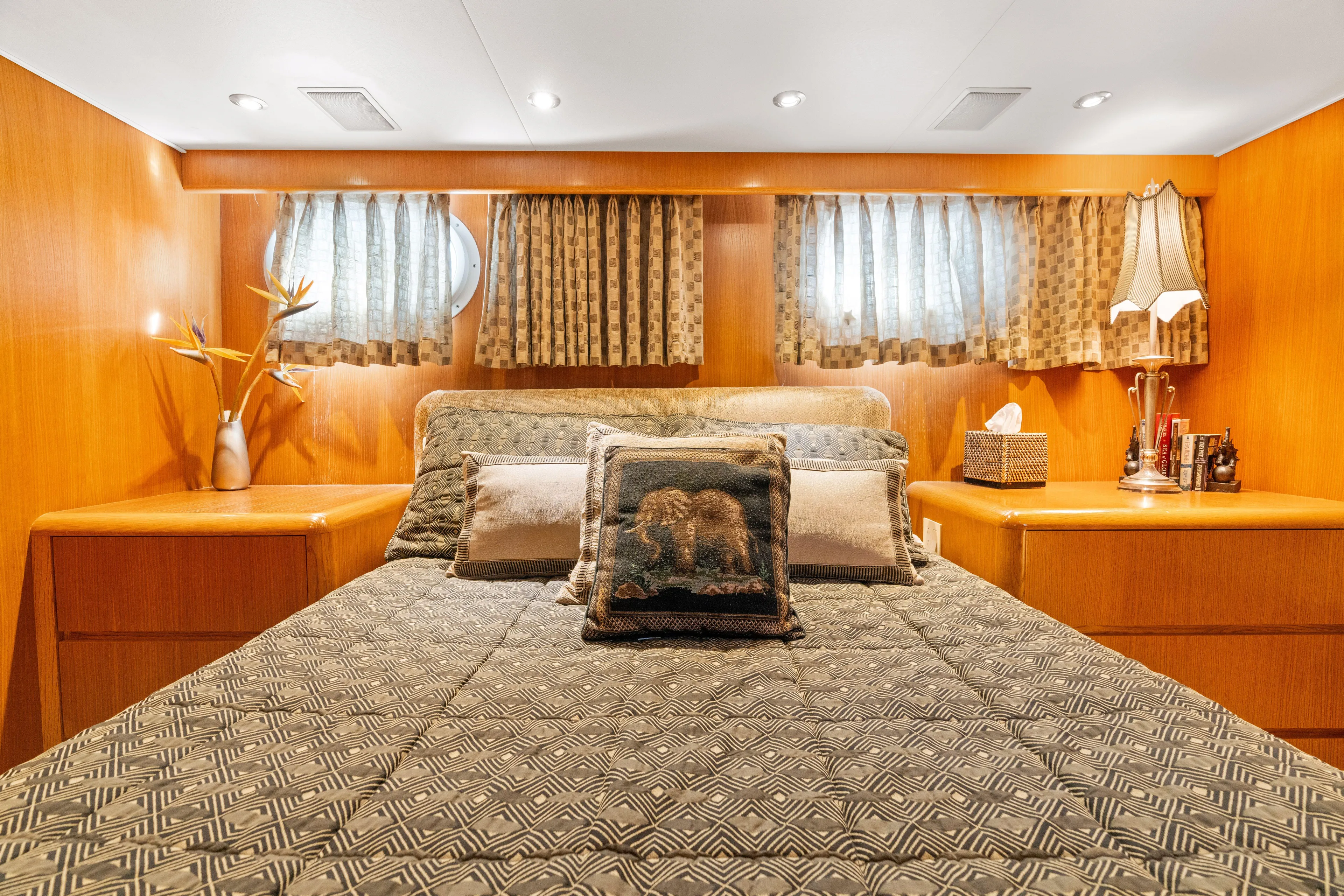Crown Jewel Yacht Photos Pics Luxurious bedroom in 1996 Broward 96 Raised Pilothouse MY yacht with elegant decor.
