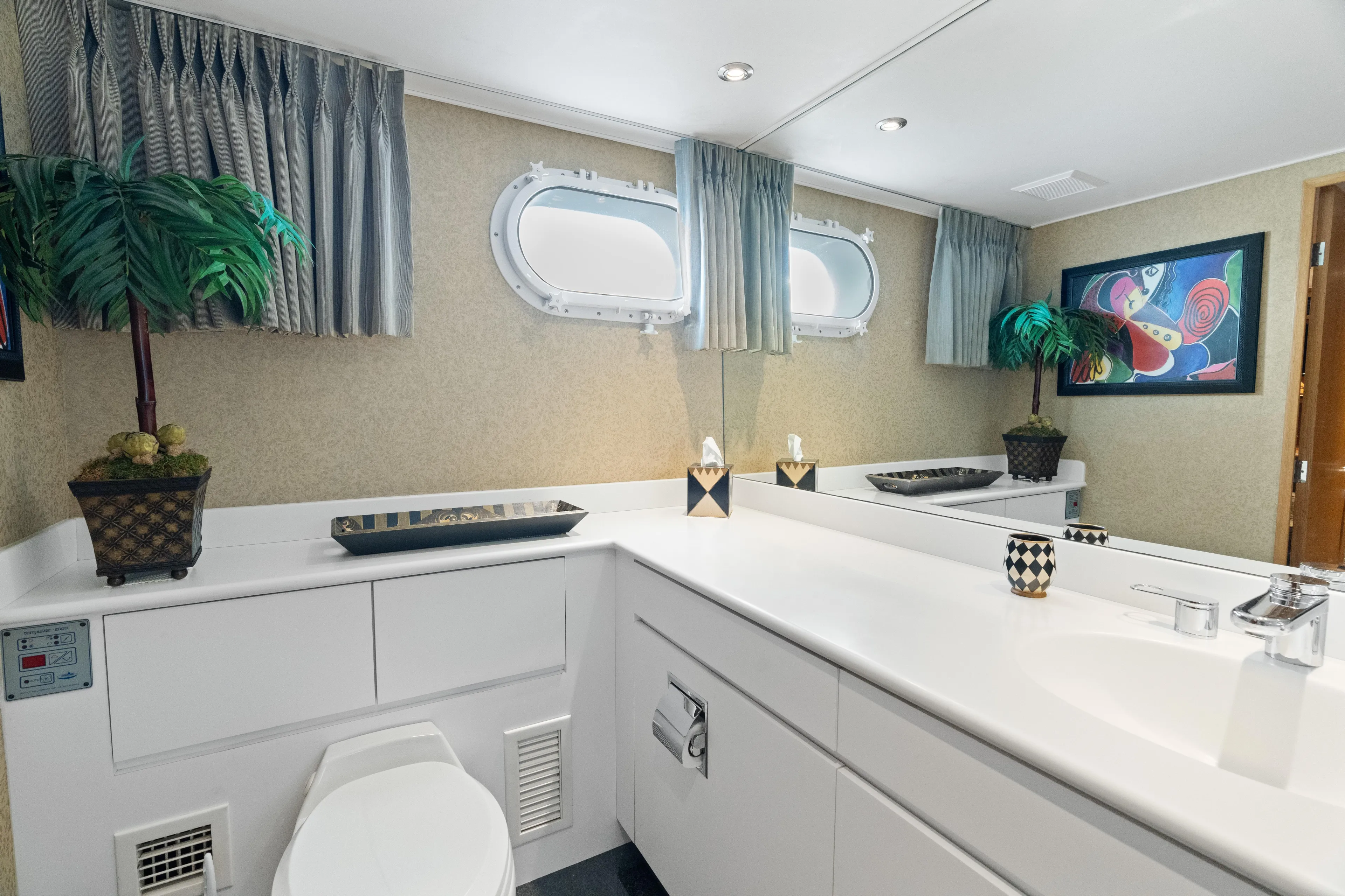 Crown Jewel Yacht Photos Pics Luxurious bathroom on 1996 Broward 96 Raised Pilothouse MY yacht with modern decor.