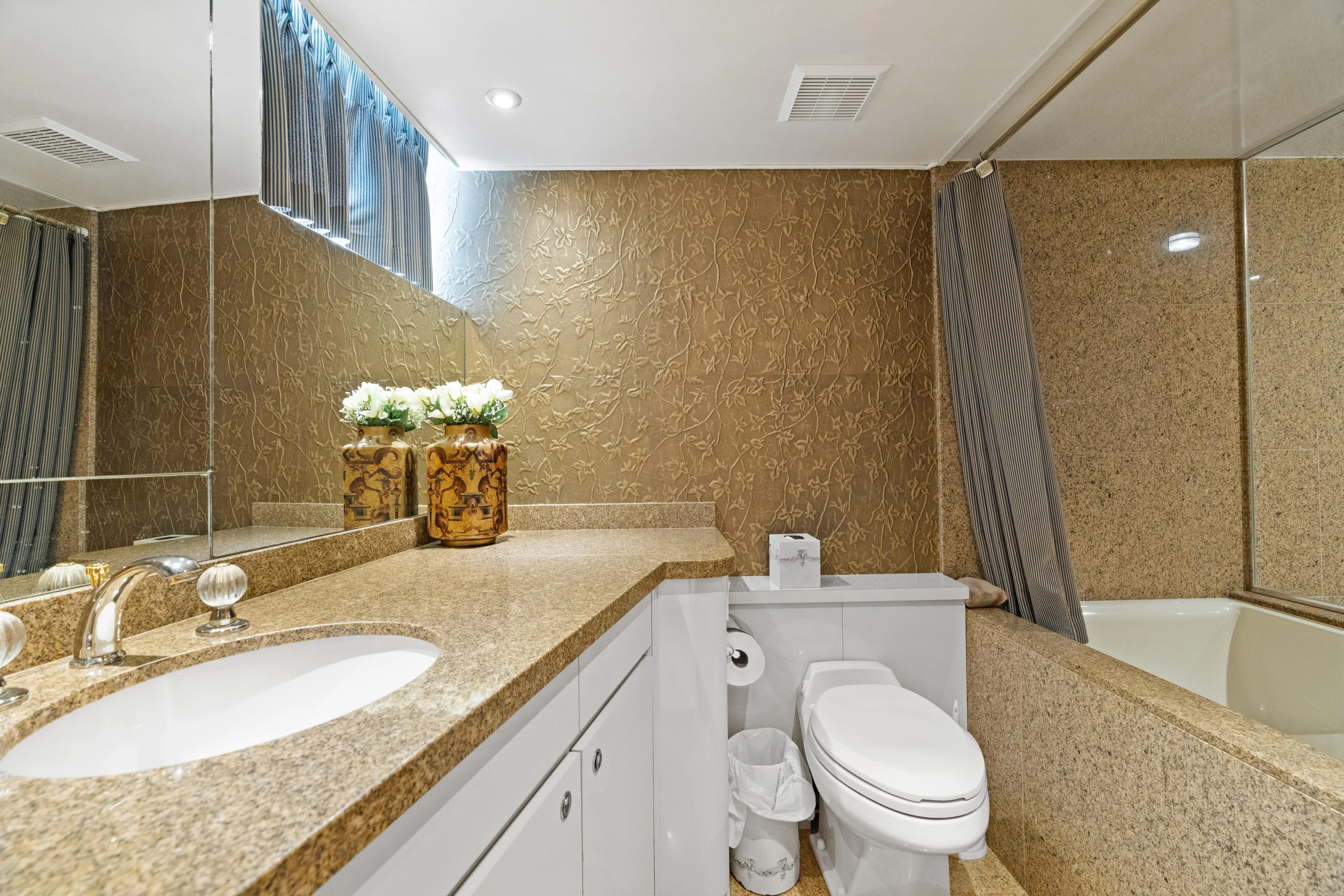 Crown Jewel Yacht Photos Pics Luxurious bathroom in 1996 Broward 96 Raised Pilothouse MY yacht with elegant decor.