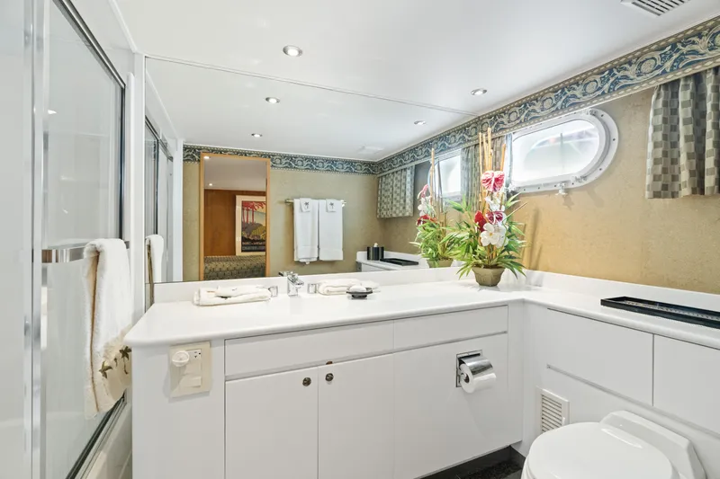 Crown Jewel Yacht Photos Pics Luxurious bathroom in 1996 Broward 96 Raised Pilothouse MY yacht, featuring elegant decor and amenities.
