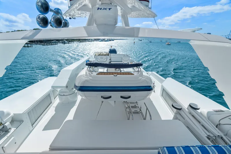 Crown Jewel Yacht Photos Pics Luxury yacht deck view, 1996 Broward 96 Raised Pilothouse MY, overlooking serene ocean waters.