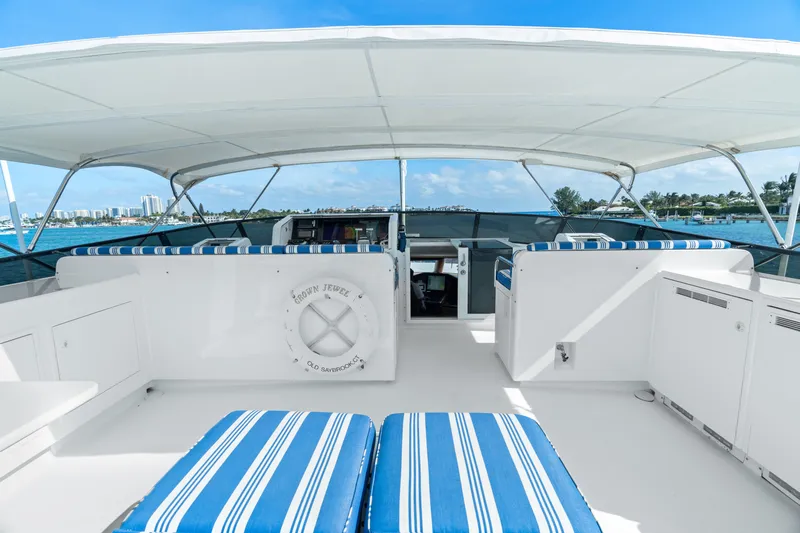 Crown Jewel Yacht Photos Pics Luxury yacht deck with striped seating, Broward 96 Raised Pilothouse MY, 1996 model.