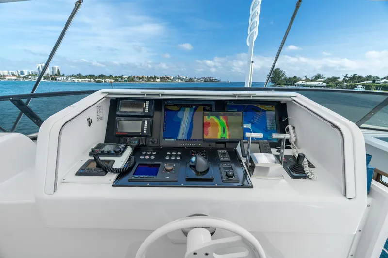 Crown Jewel Yacht Photos Pics Control panel of 1996 Broward 96 Raised Pilothouse MY yacht with navigation equipment.