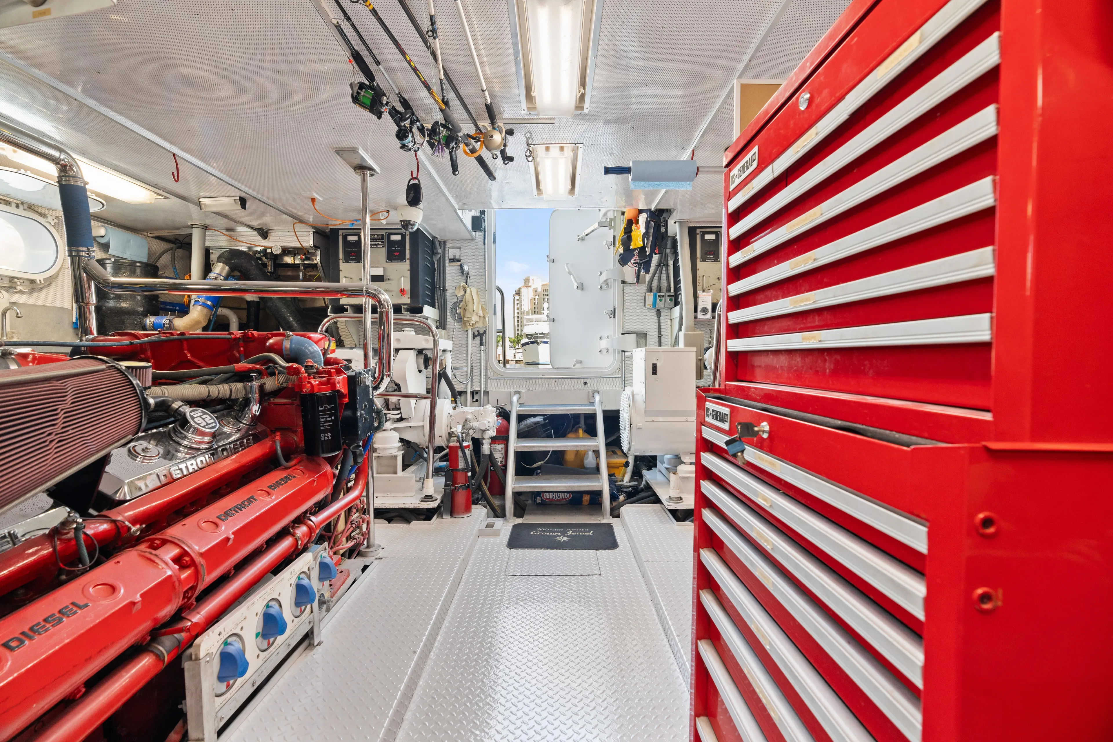 Crown Jewel Yacht Photos Pics Engine room of 1996 Broward 96 Raised Pilothouse MY with red tool chest and machinery.