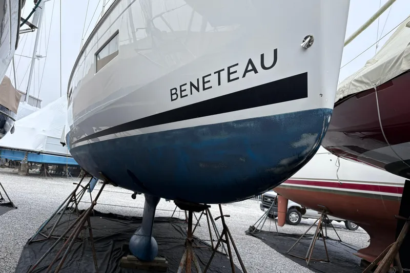  Yacht Photos Pics 2021 Beneteau Oceanis 38.1 sailboat on stands, hull view in a boatyard.