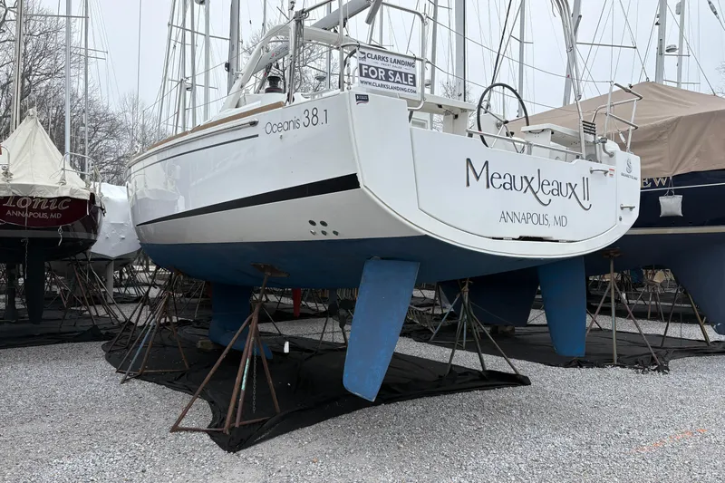  Yacht Photos Pics Beneteau Oceanis 38.1 sailboat, 2021 model, docked in Annapolis, MD, with "For Sale" sign.