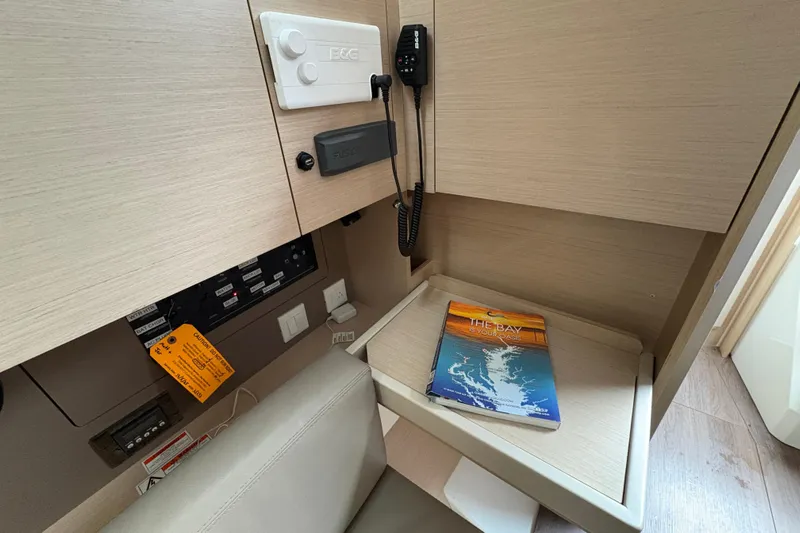  Yacht Photos Pics Interior of 2021 Beneteau Oceanis 38.1 yacht with navigation equipment and chart.