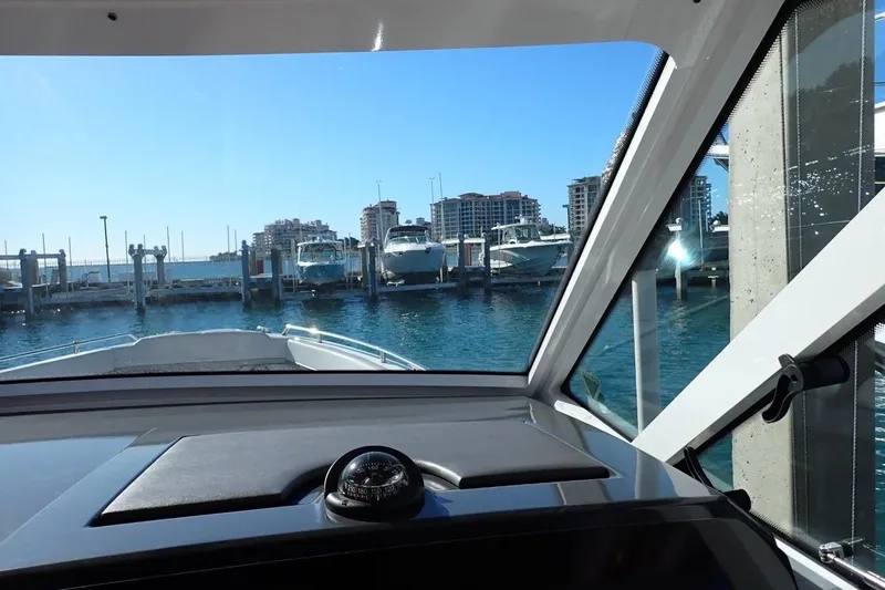  Yacht Photos Pics Interior view from a 2023 Formula 380 Super Sport Crossover OB, overlooking a marina.