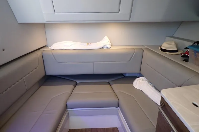  Yacht Photos Pics 2023 Formula 380 Super Sport Crossover OB cabin interior with beige seating and modern design.