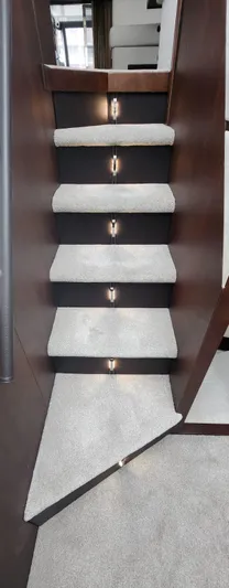  Yacht Photos Pics Staircase with carpeted steps and lighting on a 2017 Galeon 550 Fly yacht.