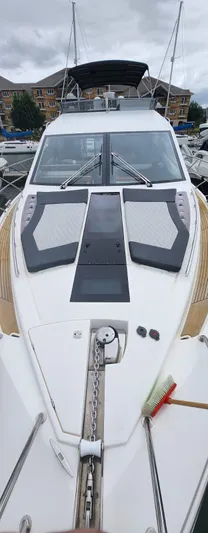  Yacht Photos Pics 2017 Galeon 550 Fly yacht with sleek deck design, docked in a marina.